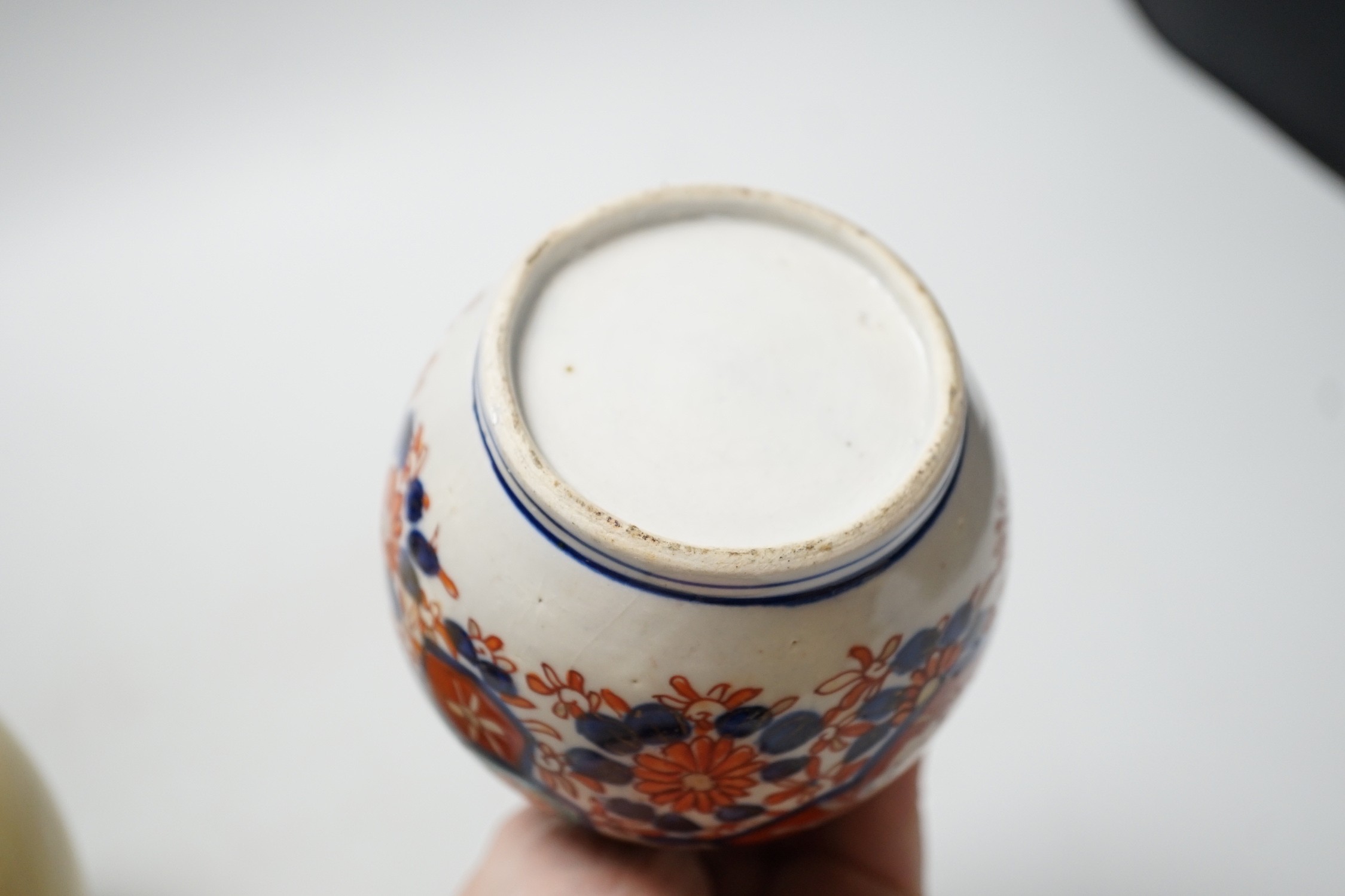 An Imari spill vase and a Chinese yellow glazed vase, tallest 23cm